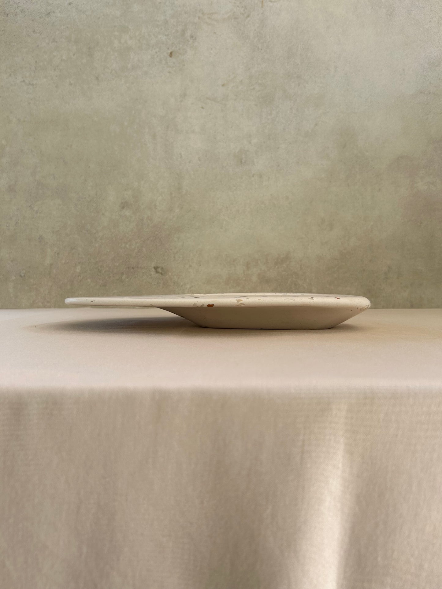 Dune Dip Platter, handmade with brown terrazzo, Eid Edit series. Elevation view.