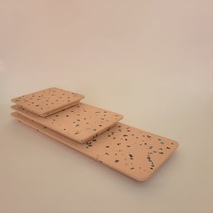 A set of handmade terrazzo serving platters and trays.