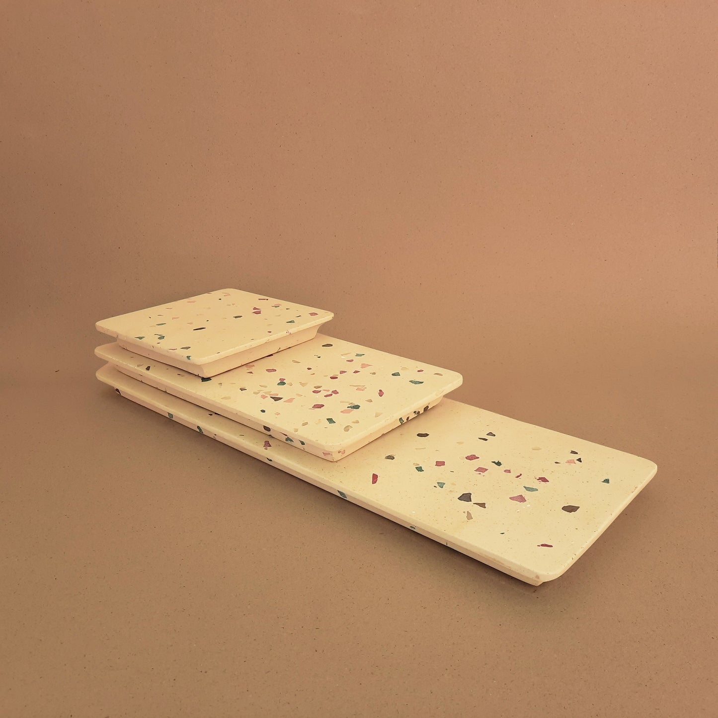 A set of handmade terrazzo serving platters and trays.2